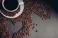 heart drawn from coffee beans and a cup with a drink saucer breakfast in bed Royalty Free Stock Photo