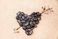 Heart drawn with pebbles on the beach sand Royalty Free Stock Photo