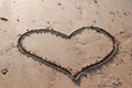 Heart drawn in the sand on the beach Royalty Free Stock Photo