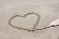 the heart is drawn on the sand on the beach with a stick you can Royalty Free Stock Photo