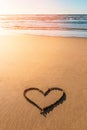 Heart drawn on sand near beautiful beach in valentines day Royalty Free Stock Photo