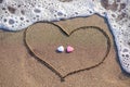 Heart drawn in the sand with two hearts Royalty Free Stock Photo