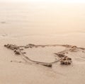 Heart drawn in the sand. Beach background. Top view Royalty Free Stock Photo