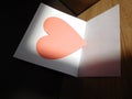 Heart enclosed in a sheet of paper to send a letter for Valentine`s Day