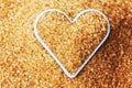 Heart filled with brown cane sugar Royalty Free Stock Photo