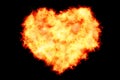 Heart filled made by burning flames on black background with fire particles, valentine day and love Royalty Free Stock Photo