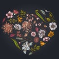 Heart floral design on dark background with japanese chrysanthemum, blackberry lily, eucalyptus flower, anemone, iris