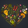 Heart floral design on dark background with lemons, broccoli, radish, green beans, cherry tomatoes, beet, greenery