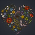 Heart floral design on dark background with shepherd`s purse, heather, fern, wild garlic, clover, globethistle, gentiana