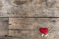 Heart and flowers on the wooden table