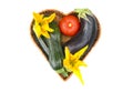 Heart form wicker plate basket and fresh vegetable Royalty Free Stock Photo