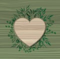 Heart frame with laurel leafs wooden background