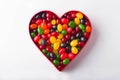 A Heart Full Of Multi-Colored Jellybeans On A White Background