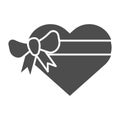 Heart gift box with bow solid icon. Love present vector illustration isolated on white. Valentine gift glyph style