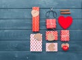 Heart and gift boxes over wooden background. Flat lay Royalty Free Stock Photo