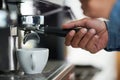 The heart of good coffee lies in its preperation. Cropped shot of a barista making a cup of coffee. Royalty Free Stock Photo