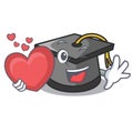 With heart graduation hat mascot cartoon Royalty Free Stock Photo