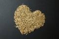 Heart from grass seeds on a black background Royalty Free Stock Photo