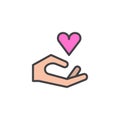 Heart in hand filled outline icon