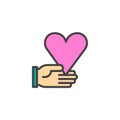 Heart in hand filled outline icon