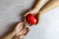 Heart in hand giving heart donation concept Royalty Free Stock Photo