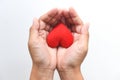 Heart on hand for philanthropy concept - woman holding red heart in hands for valentines day or donate help give love warmth take Royalty Free Stock Photo