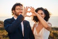 Heart hand sign, marriage and wedding couple in nature at love, trust and care celebration. Happy, smile and bride and Royalty Free Stock Photo