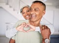 Heart, hands and couple in home for love, kindness and commitment to life partner, relationship or emoji sign. Mature Royalty Free Stock Photo