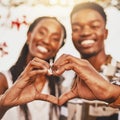 Heart hands, emoji and love of couple smile, happy and showing kindness, trust and support. Closeup of young black