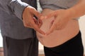 Heart hands of pregnant couple Royalty Free Stock Photo