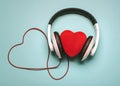 Heart with headphones and red heart-shaped clable.Romantic music concept