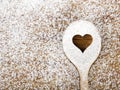 Heart hole spoon on the wooden pastry board