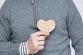 A Heart in human hands on white brick background Royalty Free Stock Photo