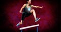 Heart icon over caucasian female athlete jumping over hurdle against grunge effect on red background