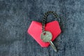 Heart and a key, connected by a chain. Royalty Free Stock Photo