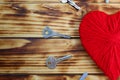 A heart of red color from yarn and keys lie around it Royalty Free Stock Photo