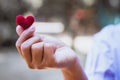 Heart knit in the hands of the girl. Royalty Free Stock Photo