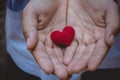 Heart knit in the hands of the girl. Royalty Free Stock Photo