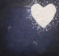 Heart, laid out rice on a blue rustic wooden background, top view, valentines day, place for text