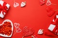 Heart lollipops: Sweet treats on a red backdrop with text space