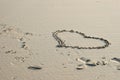 Heart of love drawn in the sand