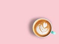 Heart love latte art coffee in white and green cup  isolated on pink pastel  background. Royalty Free Stock Photo