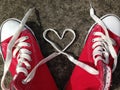 Heart Love shape symbol with sneakers teen baseball urban `teen love` or healthy heart exercise concept red boots with laces heart Royalty Free Stock Photo