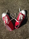 Heart Love shape symbol with sneakers teen baseball urban `teen love` or healthy heart exercise concept red boots with laces heart Royalty Free Stock Photo