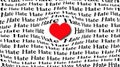 Heart of Love Surrounded by Hate Words on White Background Royalty Free Stock Photo