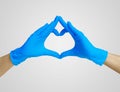 Heart made blue nitrile glove. Medic`s hands, covid