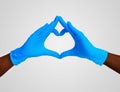 Heart made blue nitrille glove isolated. Medic`s black hands, covid, virus. Peace, love