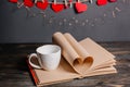 Heart made from book sheets with a cup, love and valentine concept on a wooden table Royalty Free Stock Photo