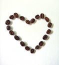 Heart made from coffee beans on white background. Coffee love , sybmol, wallpaper