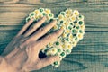 Heart made of daisies flowers in wooden background Royalty Free Stock Photo